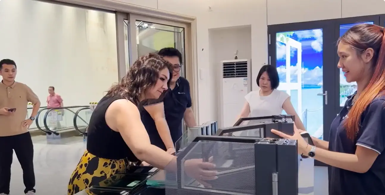 Dominica project client reviewing window and door samples in Foshan showroom